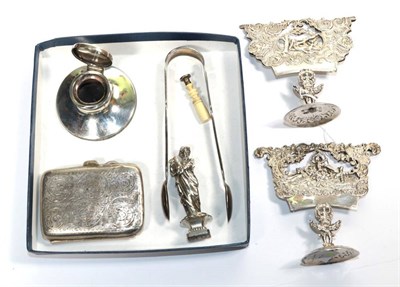 Lot 305 - A pair of Continental silver menu holders; a silver capstan inkwell; a pair of silver sugar nips; a