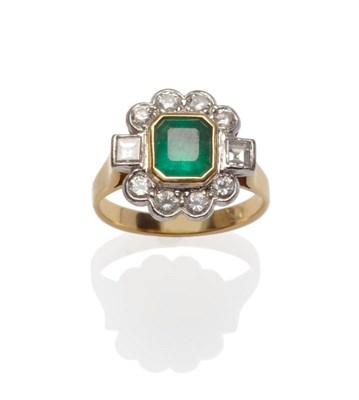 Lot 599 - An Emerald and Diamond Cluster Ring, the emerald-cut emerald in a yellow rubbed over setting,...