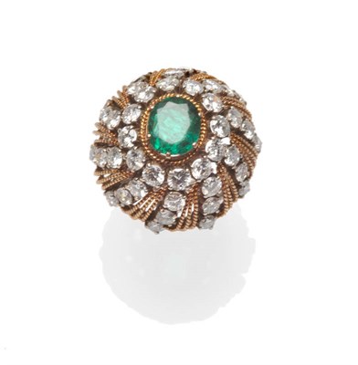 Lot 600 - A Cluster Ring, an oval cut emerald within a border of brilliant cut diamonds within diamond...