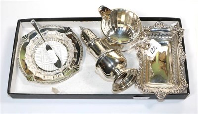 Lot 327 - A group of silver comprising: a caster of 18th Century style; a cream jug, Adie Bros, 1924; a...