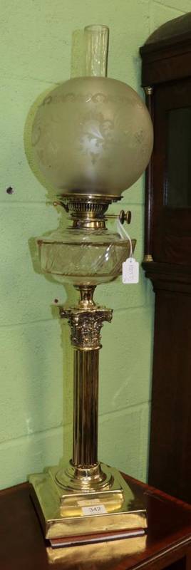 Lot 342 - A brass Corinthian column oil lamp, late 19th/early 20th century, with etched globe, cut glass...