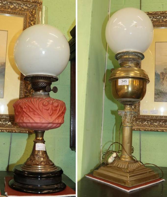 Lot 345 - A brass oil lamp with column base; and an oil lamp with glass reservoir