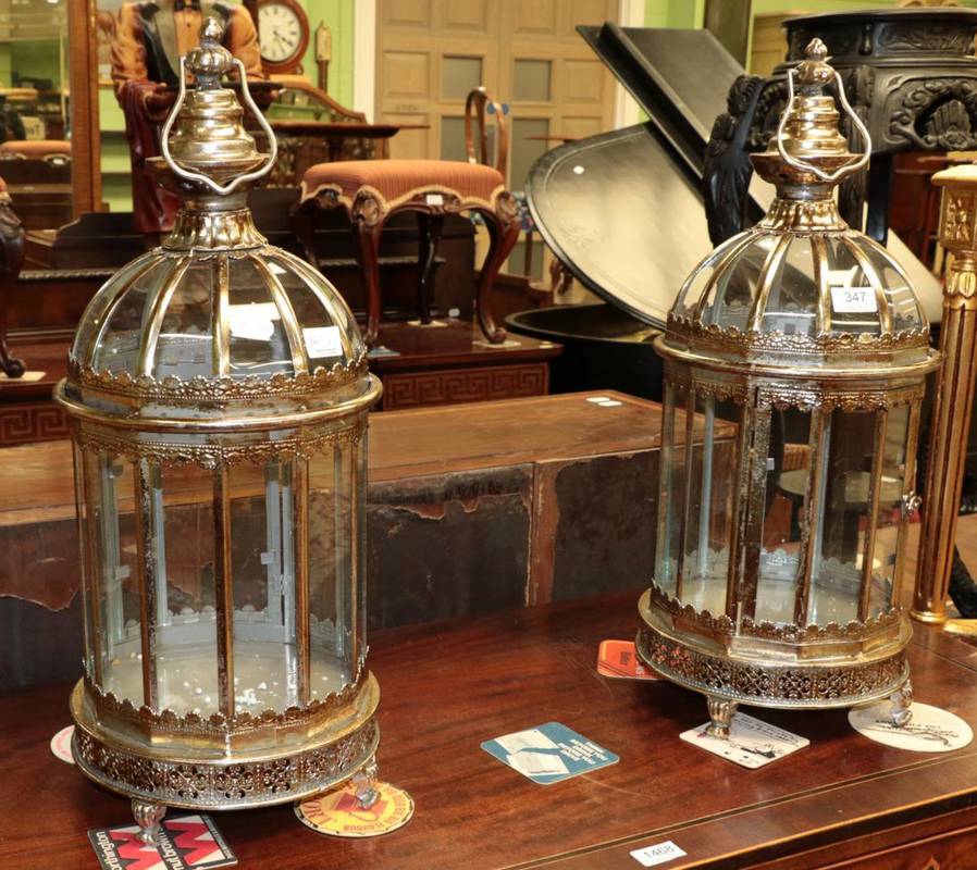 Lot 347 - A pair of metal and glass lanterns, of recent manufacture