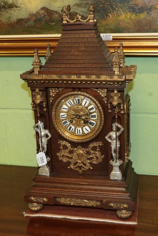 Lot 350 - A gilt metal mounted striking mantle clock of architectural form, with knights in armour pilasters