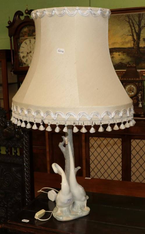 Lot 352 - A large Nao table lamp modelled as two geese a the base of a tree