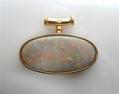 Lot 603 - A 9 Carat Gold Black Opal and Diamond Pendant, a large oval cabochon black opal in a rubbed...