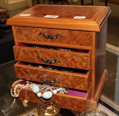 Lot 359 - Modern walnut style jewellery box modelled as a miniature chest of drawers enclosing, Rosita...