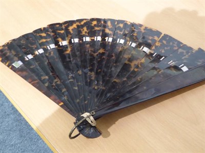 Lot 1002 - An Edwardian ivory handled folding parasol with pink silk mount; two fans; Liberty pink floral...