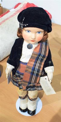Lot 1004 - Circa 1920s Chad Valley fabric doll dressed in Scottish black  velvet and red tartan outfit,...