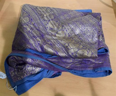 Lot 1007 - An Indian purple silk bed cover woven with silver metallic threads, on a blue cotton backing