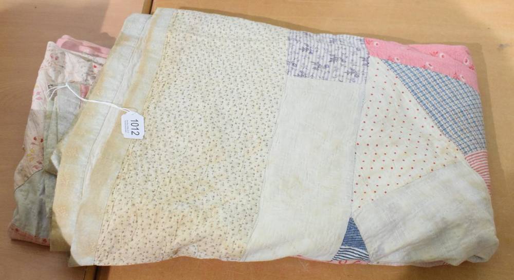 Lot 1012 - Late 19th century medallion patchwork quilt, worked in patches of pale pink, blue, red, cream...