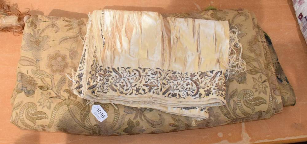 Lot 1016 - Cream satin panel with silvered embroidery and late 19th century floral woven curtain (2)