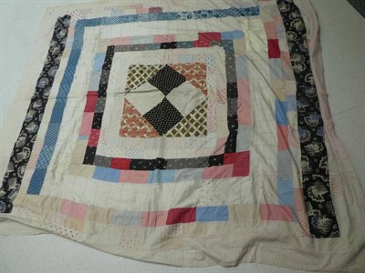 Lot 1017 - Small early 20th century patchwork coverlet, comprising 2cm squares overall in coloured and printed