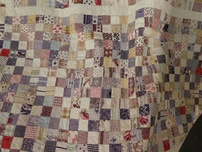 Lot 1017 - Small early 20th century patchwork coverlet, comprising 2cm squares overall in coloured and printed