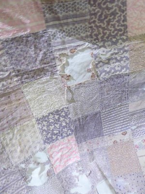 Lot 1062 - Early 19th century patchwork quilt comprising approximately 10cm squares in early printed...