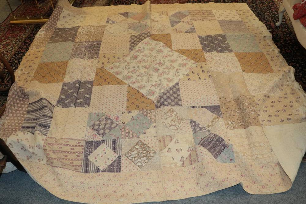 Lot 1065 - Large late 19th century medallion patchwork quilt, the centre incorporates a cotton panel of...
