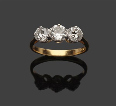 Lot 611 - A Diamond Three Stone Ring, three round brilliant cut diamonds in white claw settings to a...