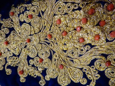 Lot 1075 - European blue velvet jacket with gold embroidery and coral type beads, similar style hat with...