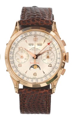 Lot 619 - A Triple Calendar Chronograph Wristwatch with Moonphase Display, signed Emarten, circa 1950,...