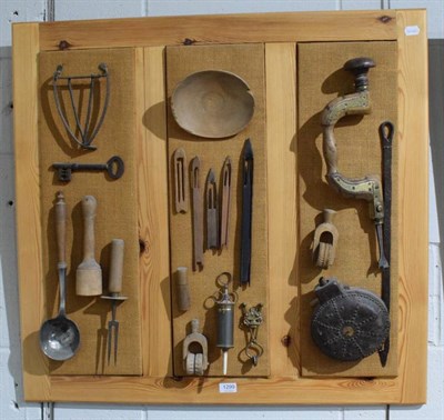 Lot 1299 - A group of early 18th century and later implements including iron key, pestle, trivet, large...