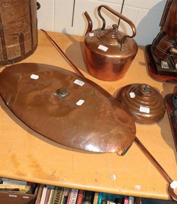 Lot 1304 - A large 19th century copper bed warmer; with another smaller; a kettle; and a foundry poker (4)