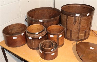 Lot 1305 - A group of twelve early 19th century and later iron bound grain measures and other containers,...