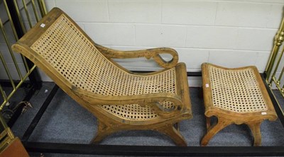 Lot 1330 - A cane seated chair and footstool