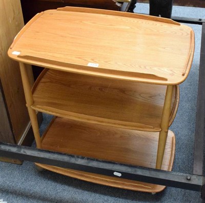 Lot 1339 - An Ercol light elm three tier trolley; and a modern rug