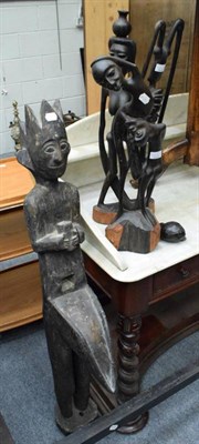 Lot 1347 - Two Makonde abstract figures; a large carved wood fertility figure, possibly Indonesian (3)