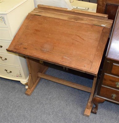 Lot 1351 - A Victorian pine child's desk with hinged top