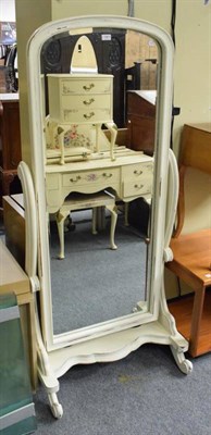 Lot 1361 - A distressed cream painted cheval mirror