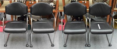 Lot 1365 - A set of four modern black leather and tubular steel chairs