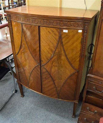 Lot 1375 - A reproduction bow fronted cabinet