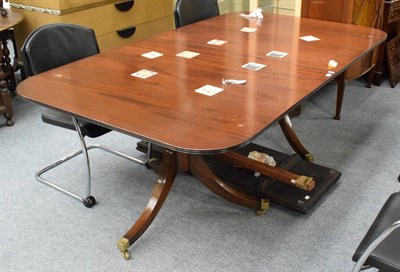 Lot 1385 - A reproduction twin-pillar dining table with two extra leaves