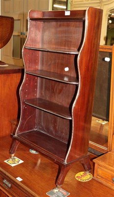 Lot 1418 - A 19th century mahogany freestanding waterfall bookcase, brass mounted, three adjustable...