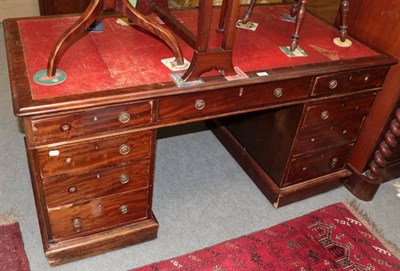 Lot 1421 - A mahogany twin pedestal desk with leather inset top