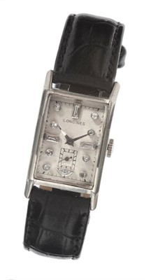 Lot 645 - An Unusual Diamond Set Dial Curved Rectangular Wristwatch, signed Longines, circa 1946,...