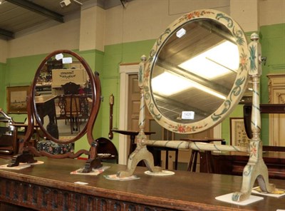 Lot 1426 - A small mahogany oval crutch frame dressing mirror, 50cm by 31cm; and a circular cream painted...