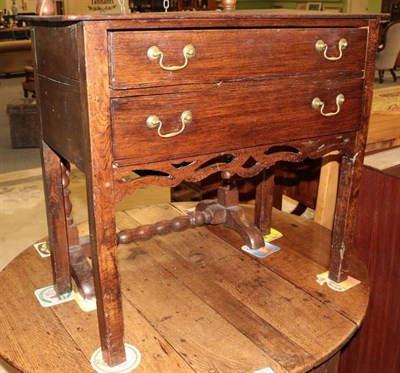 Lot 1429 - A 19th century oak lowboy