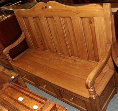 Lot 1431 - A stained pine box settle (modern), the base with three dummy drawers, 152cm by 47cm by 116cm