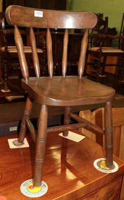 Lot 1433 - A 19th century child's beech dining chair, with curved top rail above spindle supports, the moulded