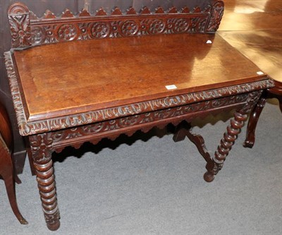 Lot 1441 - A Victorian carved and stained oak side table