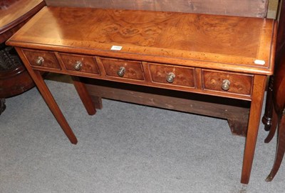 Lot 1444 - A walnut five drawer side table