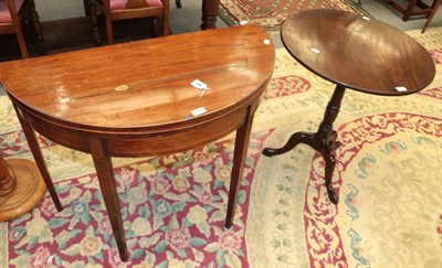 Lot 1465 - George III mahogany flip-top tripod table; and George III mahogany fold over tea table