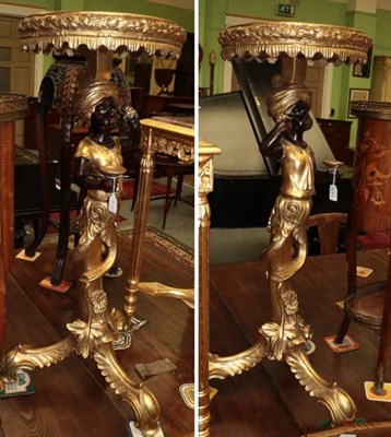 Lot 1470 - A pair of blackamoor stands