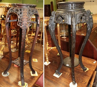 Lot 1473 - A Chinese carved hardwood plant stand; and another similar with pink marble top (2)