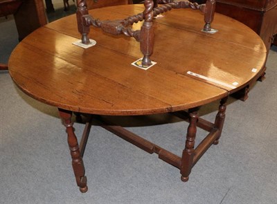 Lot 1475 - An 18th century oak six-seater dining table on spindle turned legs