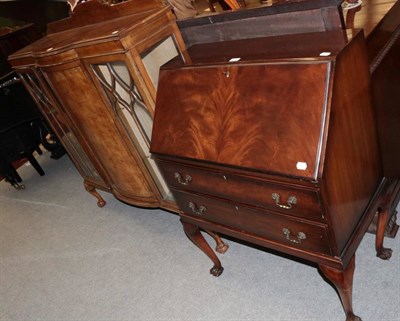 Lot 1481 - An early 20th century mahogany display cabinet; and a reproduction mahogany bureau on claw and ball