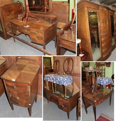 Lot 1483 - A bedroom suite comprising a dressing table, wardrobe, bedside cabinet, three chairs, two...