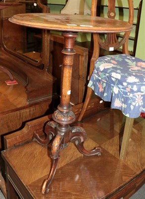 Lot 1485 - An inlaid walnut tripod table with marquetry top